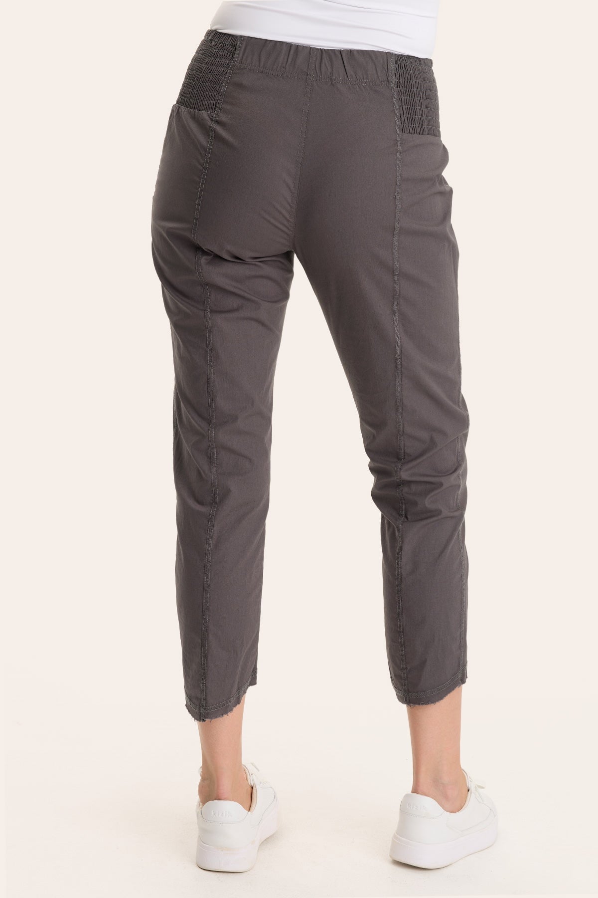 Core by Acker Zipper Slim Crop with shirred panels, zipper pockets, and raw-edge distressed rounded hem in Grey - XCVI