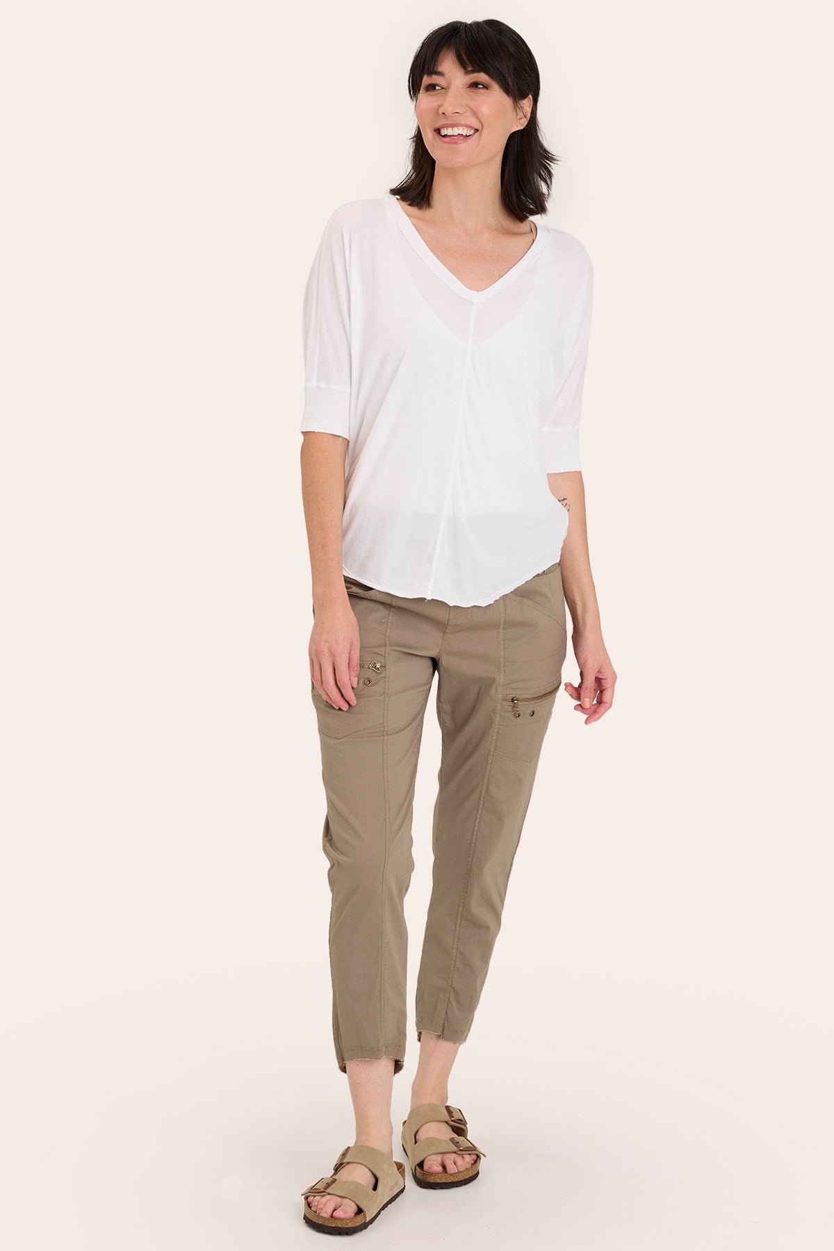 Core by Acker Zipper Slim Crop with shirred panels, zipper pockets, and raw-edge distressed rounded hem in Brown - XCVI