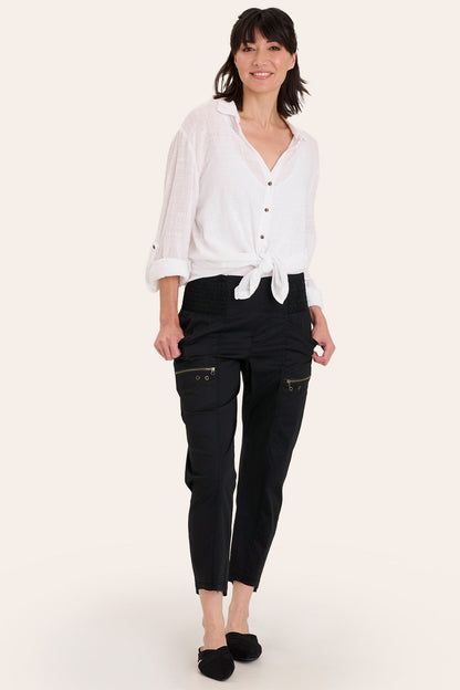 Core by Acker Zipper Slim Crop with shirred panels, zipper pockets, and raw-edge distressed rounded hem in Black  - XCVI