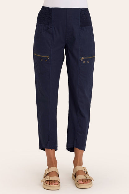 Core by Acker Zipper Slim Crop with shirred panels, zipper pockets, and raw-edge distressed rounded hem in Blue  - XCVI