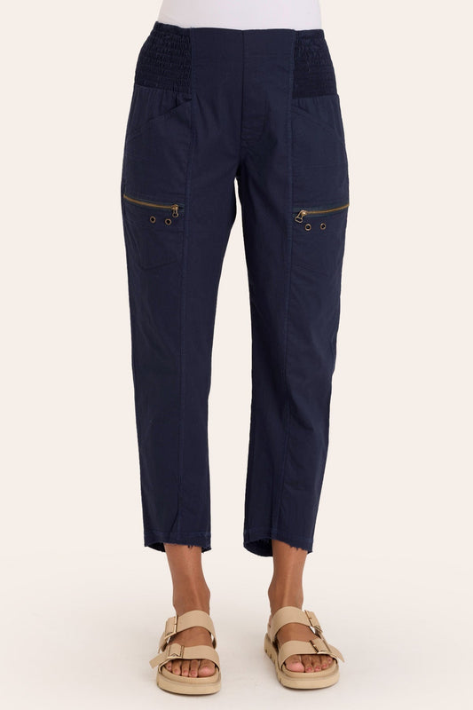 Core by Acker Zipper Slim Crop with shirred panels, zipper pockets, and raw-edge distressed rounded hem in Blue  - XCVI
