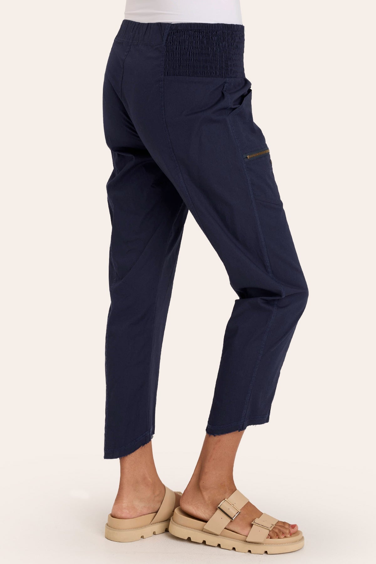 Core by Acker Zipper Slim Crop with shirred panels, zipper pockets, and raw-edge distressed rounded hem in Blue  - XCVI