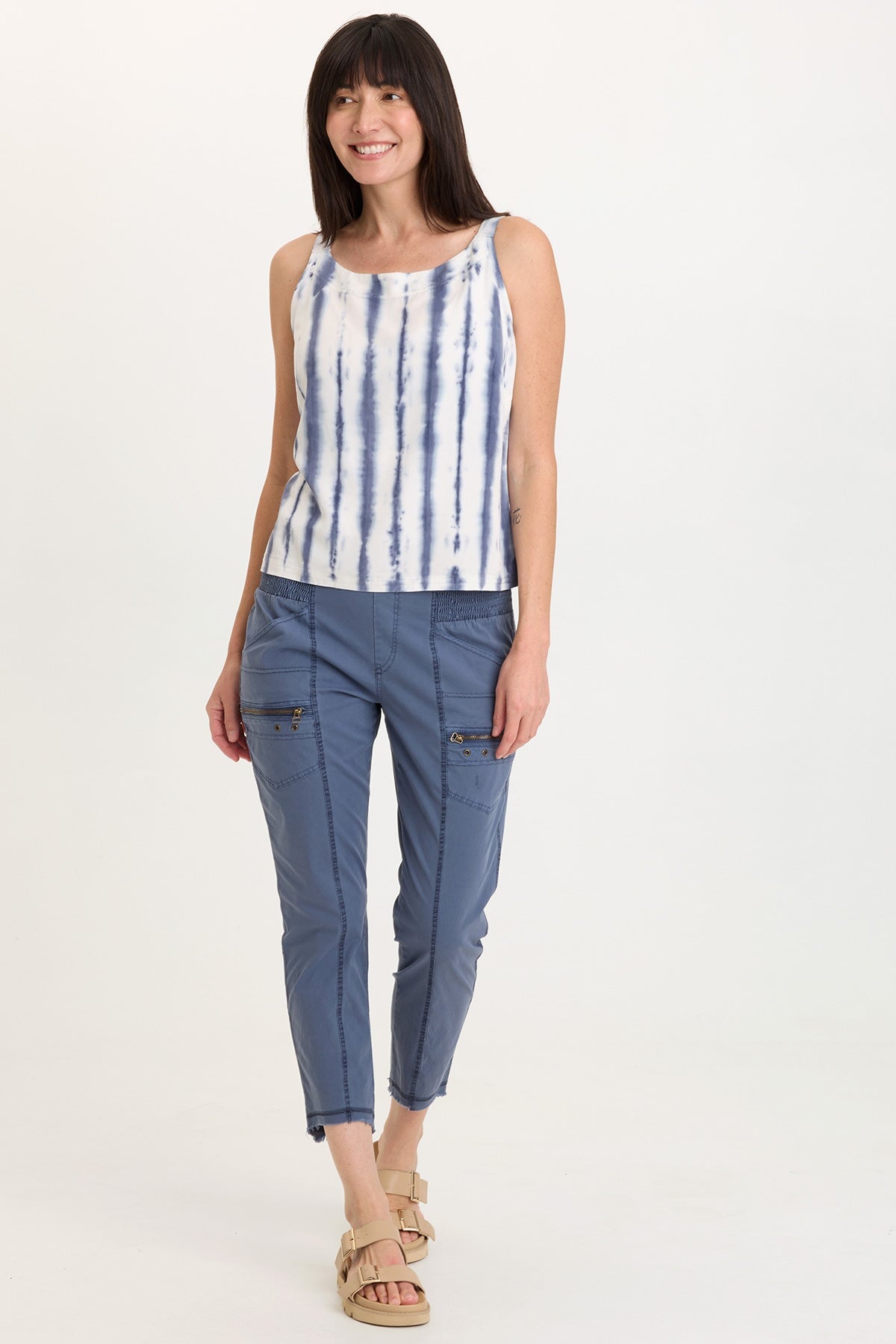 Wearables Acker Zipper Slim Crop with shirred panels, zipper pockets, and raw-edge distressed rounded hem in Blue  - XCVI