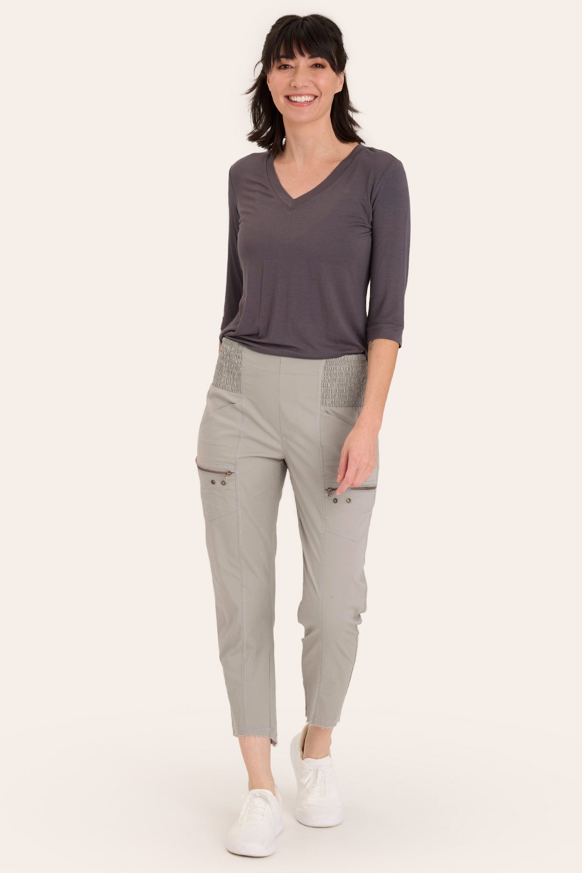 Core by Acker Zipper Slim Crop with shirred panels, zipper pockets, and raw-edge distressed rounded hem in Grey  - XCVI